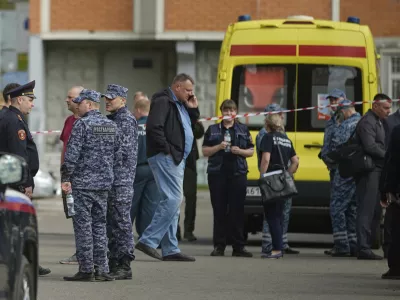 Police and investigators work at the scene where Lt. Gen. Yaroslav Moskalik, a deputy head of the main operational department in the General Staff of the Russian armed forces, was killed by an explosive device placed in his car in Balashikha, just outside Moscow, Russia, on Friday, April 25, 2025. (AP Photo)
