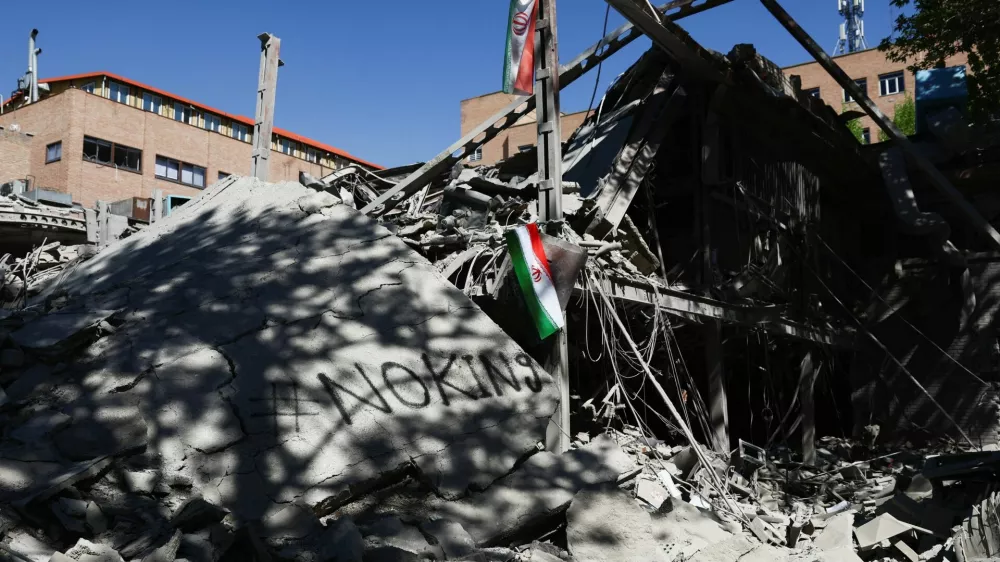 An Iranian flag hangs amidst the rubble of a building of the Sharif University of Technology, which was damaged in a strike, amid the U.S.-Israeli conflict with Iran, in Tehran, Iran, April 7, 2026. Majid Asgaripour/WANA (West Asia News Agency) via REUTERS ATTENTION EDITORS - THIS PICTURE WAS PROVIDED BY A THIRD PARTY