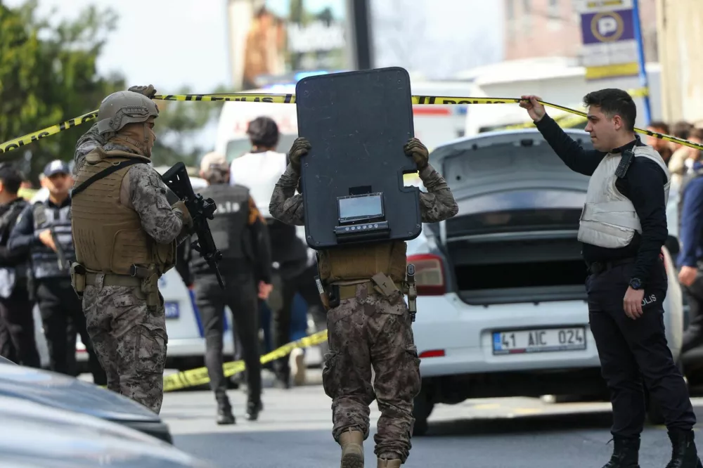 Police work at the scene, after gunfire was heard near the building housing the Israeli consulate, according to a witness, in Istanbul, Turkey, April 7, 2026. REUTERS/Murad Sezer
