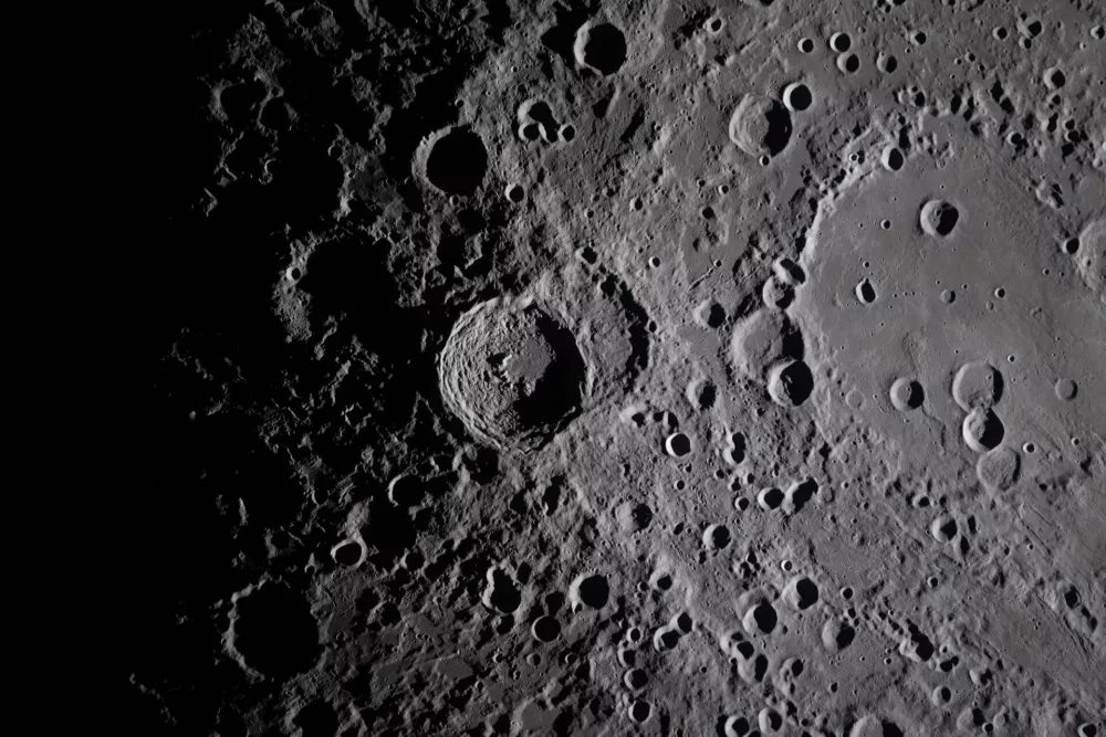 In this image provided by NASA, the Artemis II crew captured this image of the Vavilov Crater on the Moon during a lunar flyby, Monday, April 6, 2026. NASA via AP)