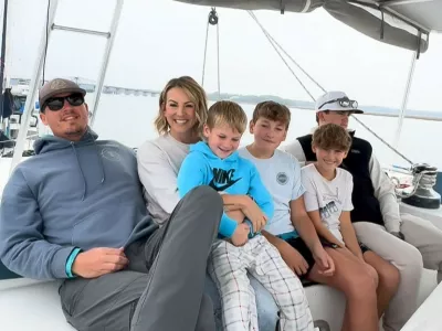 EXCLUSIVE: Story from Jam Press (Boat Life Family)'We sold our expensive house to live on a BOAT with our FOUR kids and cut our bills by 75% after watching YouTube videos&nbsp;of other families doing the same &ndash; people call us insane'A couple have shared how they sold their expensive house to live on a boat with their four kids and save thousands a month.Justin and Jen Wisdom, both 40, took the drastic step after getting fed up with the daily grind.Teacher Justin and interior designer Jen took the plunge by buying a catamaran with their four sons, Liam, 14, Langston, 13, Tavner, 11, and Tenneson, six.Despite being labelled "insane", they haven't looked back and have cut their annual bills by 75%."After almost 20 years in the same city, four kids, multiple jobs, and more moves from suburb to suburb than we can count, Justin came home one day with this wild idea, 'What if we bought a catamaran and sailed the world?'," Jen told creatorzine.com."I honestly thought he'd lost his mind."We had never sailed before, nor did we know a single person who had."But then we started watching YouTube videos of other families doing exactly that, living slower, simpler, more connected lives on the water."Little by little, what felt impossible started to feel intriguing."I could see the spark in Justin, and eventually I felt it in myself too."It was the first time in a long time we were completely on the same page, dreaming the same dream, and actually believing it might be possible."We sold everything, truly everything, except a few clothes, tools, and the essentials we knew would help us transition into boat life."In a strange way, it felt incredibly freeing."Over the years, we had accumulated this huge, mindless collection of stuff without even realising it."Letting it all go felt like hitting a reset button - simplify, start from scratch, breathe again."We loved our home and the little piece of land we had, but we didn't l.31 Mar 2026Pictured: Story from Jam Press (Boat Life Family)Pictured: L-R: Justin, Jen, Tenneson, Langston, Tanner and Liam.'We sold our expensive house to live on a BOAT with our FOUR kids and cut our bills by 75% after watching YouTube videos&nbsp;of other families doing the same &ndash; people call us insane'A couple have shared how they sold their expensive house to live on a boat with their four kids and save thousands a month.Justin and Jen Wisdom, both 40, took the drastic step after getting fed up with the daily grind.Teacher Justin and interior designer Jen took the plunge by buying a catamaran with their four sons, Liam, 14, Langston, 13, Tavner, 11, and Tenneson, six.Despite being labelled "insane", they haven't looked back and have cut their annual bills by 75%."After almost 20 years in the same city, four kids, multiple jobs, and more moves from suburb to suburb than we can count, Justin came home one day with this wild idea, 'What if we bought a catamaran and sailed the world?'," Jen told.,Image: 1087721729, License: Rights-managed, Restrictions: NO Australia, Germany, Norway, South Korea, Sweden, United Kingdom, United States, Unknown Country, Model Release: no, Pictured: Video grab: The Wisdom family