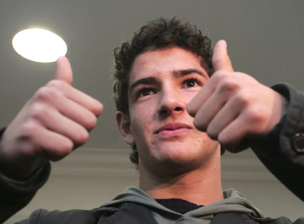 Brazilian player 18-year-old Alexandre Pato gestures to photographers after his news conference in Porto Alegre, Brazil August 2, 2007. AC Milan have confirmed that they have signed Pato from Internacional de Porto Alegre and that he will train with them and be able to play in friendly matches from September 3, 2007 and from next year he will be able to play in the official games, the AC Milan official website said. REUTERS/Edison Vara (BRAZIL)