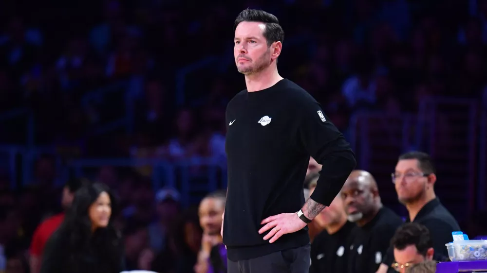 April 7, 2026; Los Angeles, California, USA; Los Angeles Lakers head coach JJ Redick watches game action against the Oklahoma City Thunder during the first half at Crypto.com Arena. Mandatory Credit: Gary A. Vasquez-Imagn Images