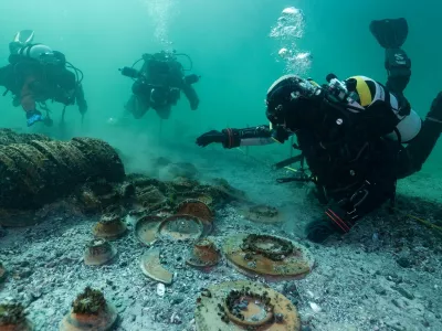 EXCLUSIVE: Story from Jam Press (Roman Shipwreck Hoard)Perfectly persevered treasure from 2,000-year old shipwreck found by diversDivers have uncovered a stunning haul of perfectly preserved treasure from a 2,000-year-old Roman shipwreck lying at the bottom of a lake.Hundreds of ancient objects were found resting on the lakebed &ndash; exactly where they settled when the vessel sank centuries ago.Remarkably, while the boat itself has long since vanished, its cargo remains largely intact.The incredible discovery was made in Lake Neuch&acirc;tel, Switzerland, after aerial photography in November 2024 spotted signs of submerged heritage.Follow-up dives and a full excavation in March 2025 revealed the extraordinary find, as reported by&nbsp;creatorzine.com.The operation is being led by the Cantonal Archaeology Office of Neuch&acirc;tel (OARC), alongside the Octopus Foundation and the Archaeological Service of the State of Fribourg.In a statement, officials said: "The richness and diversity of this collection of goods, in an excellent state of preservation, make this discovery exceptional, unique in Switzerland and in the inland waters north of the Alps."Experts believe the cargo dates from between 20 and 50 AD and once belonged to a Roman merchant vessel.Archaeologists said the find is particularly rare as the goods were not scattered, but preserved in a tight cluster &ndash; still reflecting how they had originally been packed and transported.But the race is now on to protect the fragile site.OARC warned the wreck is under threat from erosion, boat anchors and even looters.In a statement, the organisation said the cargo is exposed to "erosion of the lake bed, the anchoring of pleasure boats&hellip; and above all acts of vandalism and looting".They added that the most vulnerable items have already been recovered as a precaution.The haul includes hundreds of intact ceramic vessels &ndash; such as dishes, plates, bowls and cups &ndash; produced across the S.31 Mar 2026Pictured: Story from Jam Press (Roman Shipwreck Hoard)Perfectly persevered treasure from 2,000-year old shipwreck found by diversDivers have uncovered a stunning haul of perfectly preserved treasure from a 2,000-year-old Roman shipwreck lying at the bottom of a lake.Hundreds of ancient objects were found resting on the lakebed &ndash; exactly where they settled when the vessel sank centuries ago.Remarkably, while the boat itself has long since vanished, its cargo remains largely intact.The incredible discovery was made in Lake Neuch&acirc;tel, Switzerland, after aerial photography in November 2024 spotted signs of submerged heritage.Follow-up dives and a full excavation in March 2025 revealed the extraordinary find, as reported by&nbsp;creatorzine.com.The operation is being led by the Cantonal Archaeology Office of Neuch&acirc;tel (OARC), alongside the Octopus Foundation and the Archaeological Service of the State of Fribourg.In a statement, officials said: "T.,Image: 1087720683, License: Rights-managed, Restrictions: NO Australia, Germany, Norway, South Korea, Sweden, United Kingdom, United States, Unknown Country, Model Release: no, Pictured: Divers exploring the shipwreck