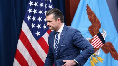 U.S. Secretary of Defense Pete Hegseth walks, as he attends a press briefing in the Pentagon Press briefing room, following the announcement of a two-week ceasefire in the Iran war, at the Pentagon in Washington, D.C., U.S., April 8, 2026. REUTERS/Kevin Lamarque