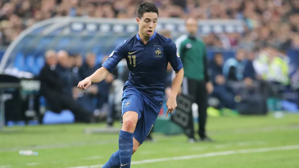 FILE - France's Samir Nasri, controls the ball during their group I World Cup qualifying soccer match between France and Finland at the Stade de France stadium in Saint Denis outside of Paris, Oct. 15, 2013. (AP Photo/Michel Euler, File)