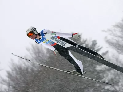 Domen Prevc of Slovenia in action during the men's team flying trial round at the Nordic skiing/ski jumping World Championships in Oberstdorf, Germany, Sunday Jan. 25, 2026. (Karl-Josef Hildenbrand/dpa via AP)
