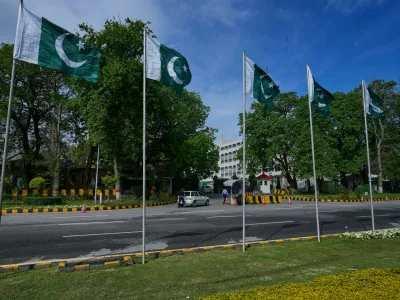 Security officers search a car at the main entrance of Pakistan's foreign ministry to ensure security ahead of the United States and Iran possible negotiations in Pakistani capital after two-week ceasefire, in Islamabad, Pakistan, Thursday, April 9, 2026. (AP Photo/Anjum Naveed)