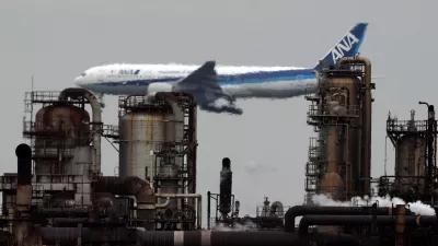 An All Nippon Airways airplane flies past an oil refinery as it approaches to land at Tokyo's Haneda airport, as seen from a park in the Keihin Industrial Zone in Kawasaki, south of Tokyo, Japan, March 17, 2026. REUTERS/Issei Kato   TPX IMAGES OF THE DAY