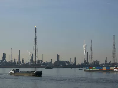 Boats past a TotalEnergies refining and petrochemicals platform in the port of Antwerp, Belgium April 9, 2026. REUTERS/Yves Herman
