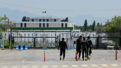 Police officers walk towards the President house, as Pakistan prepares to host the U.S. and Iran for peace talks, in Islamabad, Pakistan, April 10, 2026. REUTERS/Akhtar Soomro