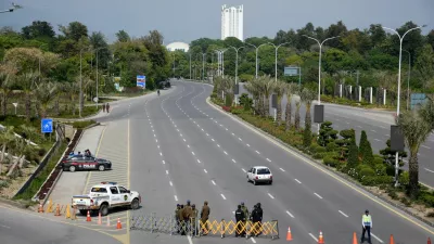 Members of security personnel stand guard on a road leading to the Serena Hotel as delegations from the United States and Iran are expected to hold peace talks, in Islamabad, Pakistan, April 11, 2026. REUTERS/Waseem Khan