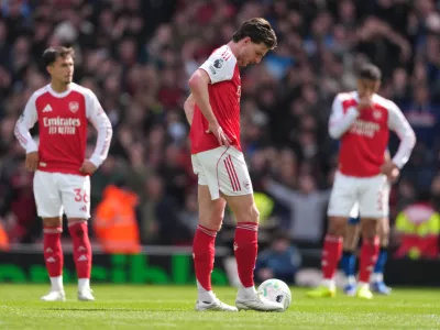 Arsenal's Declan Rice stands dejeted after conceding a goal during the Premier League soccer match between Arsenal and Bournemouth in London, England Saturday, April 11, 2026. (AP Photo/Dave Shopland)