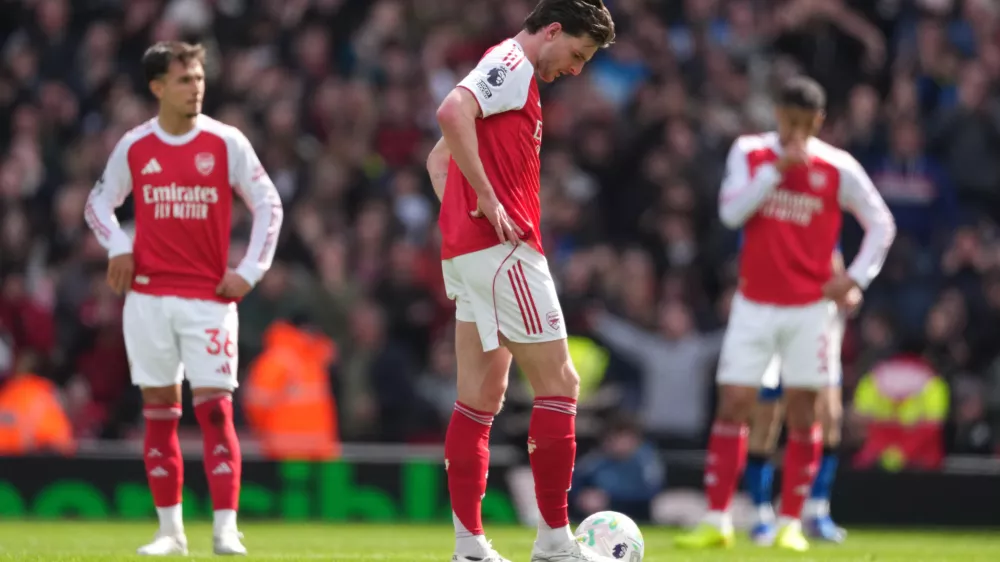 Arsenal's Declan Rice stands dejeted after conceding a goal during the Premier League soccer match between Arsenal and Bournemouth in London, England Saturday, April 11, 2026. (AP Photo/Dave Shopland)