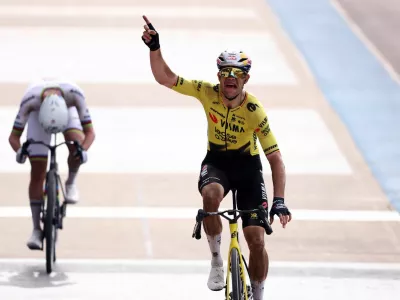 Cycling - Paris-Roubaix - Paris, France - April 12, 2026 Team Visma | Lease a Bike's Wout van Aert celebrates after crossing the finish line to win the 2026 Paris-Roubaix REUTERS/Christian Hartmann