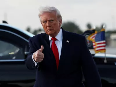 U.S. President Donald Trump gives a thumbs up as he arrives at Miami International Airport in Florida, U.S., April 11, 2026. REUTERS/Kevin Lamarque