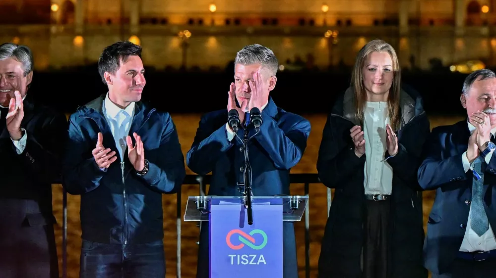 Peter Magyar, leader of the opposition Tisza party, and other officials celebrate following the partial results of the parliamentary election, in Budapest, Hungary, April 12, 2026. REUTERS/Marton Monus