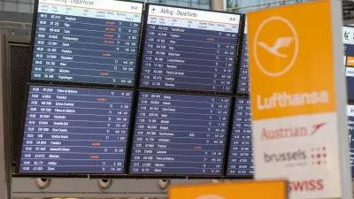 Canceled flights are shown on a display board at the airport in Hamburg, Germany, Friday, April 10, 2026. (Bodo Marks/dpa via AP)