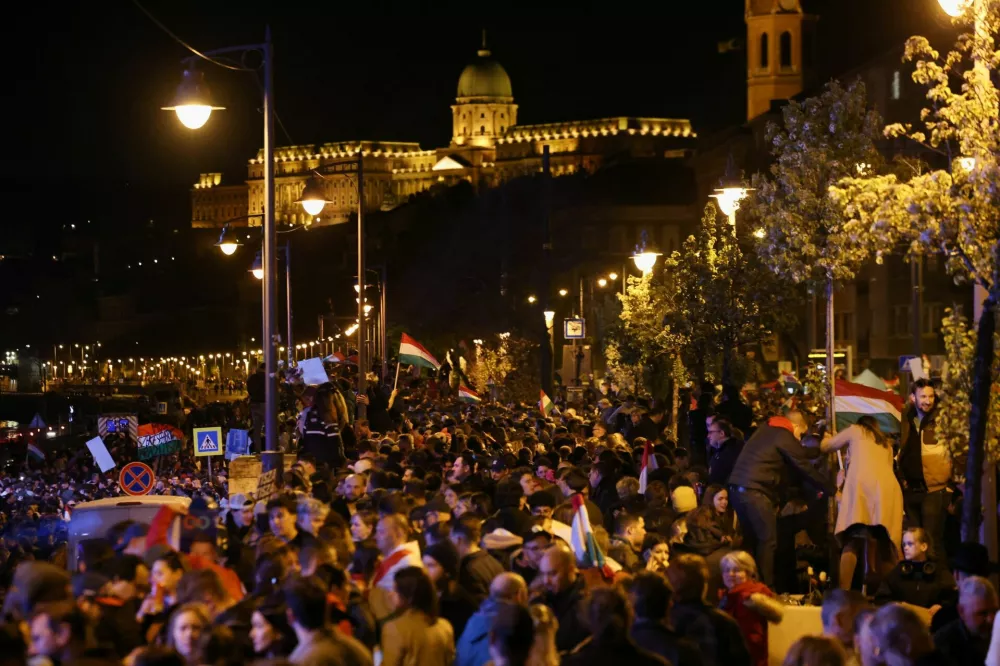 People celebrate following partial results on the day of the Hungarian Parliamentary election in Budapest, Hungary, April 13, 2026. REUTERS/Bernadett Szabo
