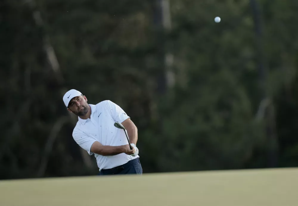 Golf - The Masters - Augusta National Golf Club, Augusta, Georgia, U.S. - April 12, 2026 Scottie Scheffler of the U.S. plays a shot on the 18th hole during the final round REUTERS/Brian Snyder