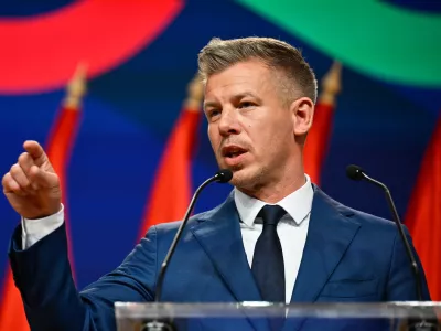 Peter Magyar gestures as he speaks to the media in Budapest, Hungary, Monday, April 13, 2026, after defeating Prime Minister Viktor Orban's party in the country's parliamentary elections. (AP Photo/Denes Erdos)