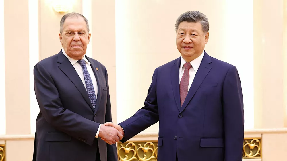 Chinese President Xi Jinping and Russia's Foreign Minister Sergei&nbsp;Lavrov&nbsp;shake hands at the Great Hall of the People in Beijing, China April 15, 2026.  China Daily via REUTERS ATTENTION EDITORS - THIS PICTURE WAS PROVIDED BY A THIRD PARTY. CHINA OUT. NO COMMERCIAL OR EDITORIAL SALES IN CHINA.   TPX IMAGES OF THE DAY
