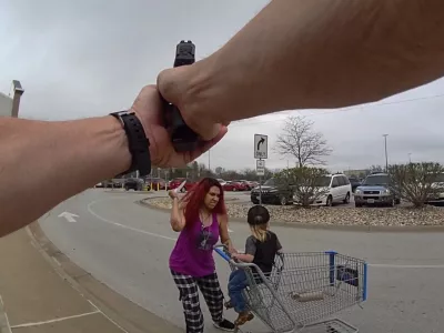 Policista sta ustrelila žensko, ki je z nožem napadla otroka. 