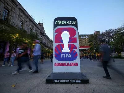 People walk past a countdown clock for the FIFA World Cup 2026 as the city prepares for the tournament, jointly hosted by the United States, Canada and Mexico, in Guadalajara, Mexico, March 24, 2026. REUTERS/Eloisa Sanchez
