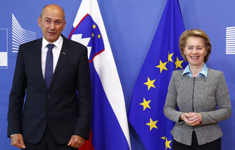 Slovenian Prime Minister Janez Jansa, left, poses with European Commission President Ursula von der Leyen prior to a meeting at EU headquarters in Brussels, Thursday, July 9, 2020. (Francois Lenoir, Pool Photo via AP)