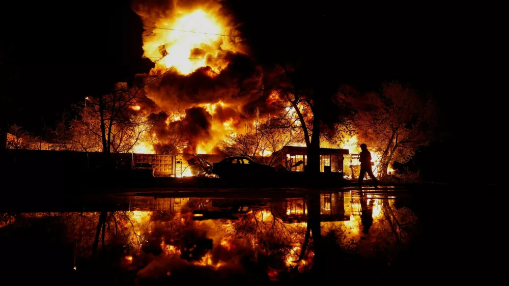 A firefighter works at the site of recyclable materials hit by a Russian missile strike, amid Russia's attack on Ukraine, in Kyiv, Ukraine, April 16, 2026. REUTERS/Valentyn Ogirenko