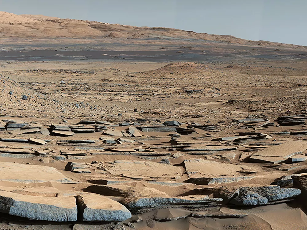 A portion of the view from the "Kimberley" formation on Mars taken by NASA's Curiosity rover, released by the U.S. space agency on October 8, 2015. The strata in the foreground dip towards the base of Mount Sharp, indicating flow of water toward a basin that existed before the larger bulk of the mountain formed. NASA/JPL-Caltech/MSSS/Handout via REUTERS. THIS IMAGE HAS BEEN SUPPLIED BY A THIRD PARTY