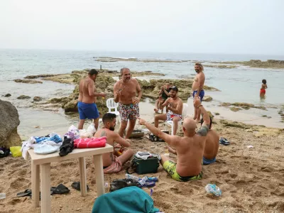 Locals celebrate at the beach, after the 10-days ceasefire between Israel and Lebanon, in Tyre, south Lebanon, April 17, 2026. REUTERS/Louisa Gouliamaki