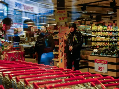 Armed police stand inside a supermarket, where Ukrainian police killed a man who opened fire in a city district and barricaded himself into the supermarket on Saturday, Ukrainian Interior Minister Ihor Klymenko said, in Kyiv, Ukraine, April 18, 2026. REUTERS/Valentyn Ogirenko