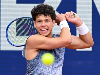 Ben Shelton of the US in action against Italy's Flavio Cobolli during the men's singles final match at the ATP Tour in Munich, Germany, Sunday April 19, 2026. (Sven Hoppe/dpa via AP)