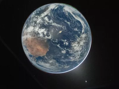 This image provided by NASA shows a view of Earth taken by NASA astronaut and Artemis II Commander Reid Wiseman from of the Orion spacecraft's window after completing the translunar injection burn on April 2, 2026. (NASA via AP)