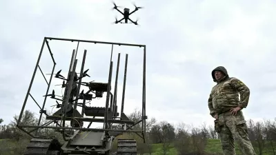 Ukrainian servicemen launch radio controlled and optic fibre controlled FPV-drones from an unmanned ground vehicle during testing at a training ground near a front line, amid Russia's attack on Ukraine, in Zaporizhzhia region, Ukraine April 10, 2026. REUTERS/Stringer
