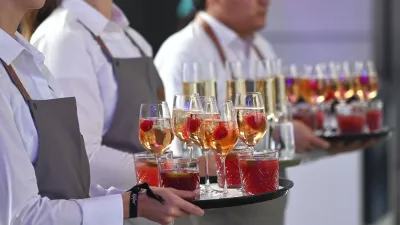 Waitress, service staff in the restaurant industry at work, tray with drinks. Waiter, female, woman, man?,Image: 1047842755, License: Rights-managed, Restrictions: GERMANY OUT, Model Release: no