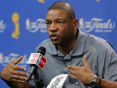 Boston Celtics coach Doc Rivers speaks during a news conference at the 2010 NBA Finals basketball series in Boston, Massachusetts June 12, 2010. The 2010 NBA Finals resumes June 13 when the Celtics and Los Angeles Lakers meet in Game 5 in Boston. REUTERS/Adam Hunger (UNITED STATES - Tags: SPORT BASKETBALL)
