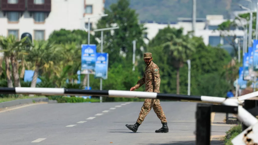 A Pakistani army soldier walks on the premises of the Serena Hotel, as Pakistan prepares to host the U.S. and Iran for the second phase of peace talks in Islamabad, Pakistan, April 21, 2026. REUTERS/Akhtar Soomro