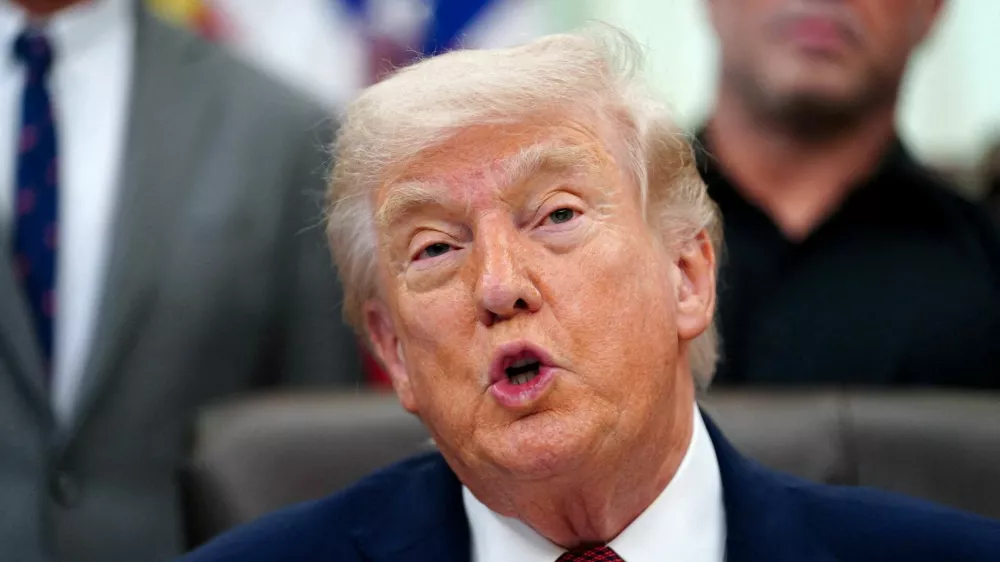 FILE PHOTO: U.S. President Donald Trump speaks about research into mental health treatments in the Oval Office of the White House in Washington, D.C., April 18, 2026. REUTERS/Nathan Howard/File Photo