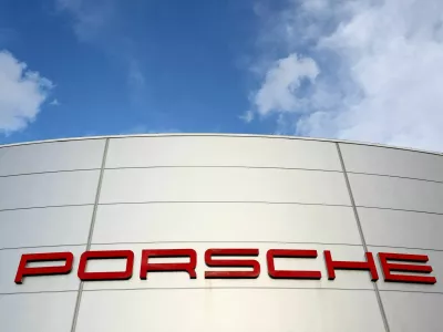 FILE PHOTO: A logo of Porsche is seen outside a Porsche car dealer in Brussels, Belgium March 13, 2023. REUTERS/Yves Herman/File Photo/File Photo