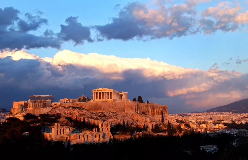 ** ADVANCE FOR WEEKEND EDITIONS JULY 10- 11 ** Sunlight catches clouds behind the ancient Acropolis in Athens in this file Feb. 3, 2004 file photo. The map says Athens is unquestionably a European metropolis. Even the name of the continent comes from Greek mythology. (AP Photo/Petros Giannakouris, File)