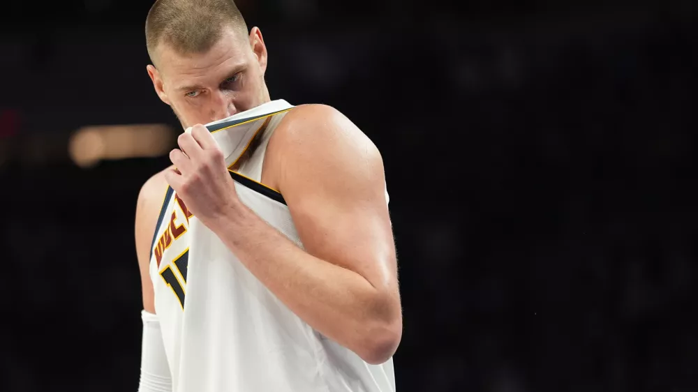 Denver Nuggets center Nikola Jokic (15) waits for play to resume during the second half in Game 3 of a first-round NBA basketball playoff series against the Minnesota Timberwolves, Thursday, April 23, 2026, in Minneapolis. (AP Photo/Abbie Parr)