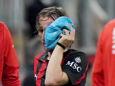 AC Milan's Luka Modric is injured during the Serie A soccer match between AC Milan and Juventus, in Milan, Italy, Sunday, April 26, 2026. (Spada/LaPresse via AP)