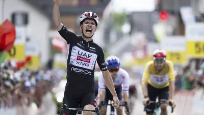 Joao Almeida of Portugal wins the seventh stage, a 207 km race from Neuhausen am Rheinfall to Emmetten, at the 88th Tour de Suisse UCI World Tour cycling race, Saturday, June 21, 2025. (Gian Ehrenzeller/Keystone via AP)