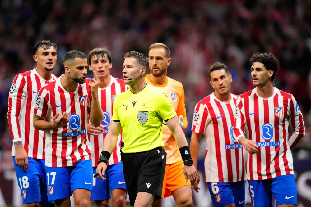 Atletico players react after referee Danny Makkelie initially awarded Arsenal a penalty during a Champions League semifinal, first leg, soccer match between Atletico Madrid and Arsenal in Madrid, Spain, Wednesday, April 29, 2026. (AP Photo/Jose Breton)