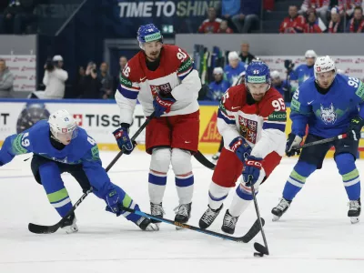Ice Hockey - IIHF World Championships - Group B - Slovenia v Czech Republic - BCF Arena, Fribourg, Switzerland - May 16, 2026 Czech Republic's Daniel Vozenilek and David Tomasek in action with Slovenia's Filip Sitar REUTERS/David W Cerny