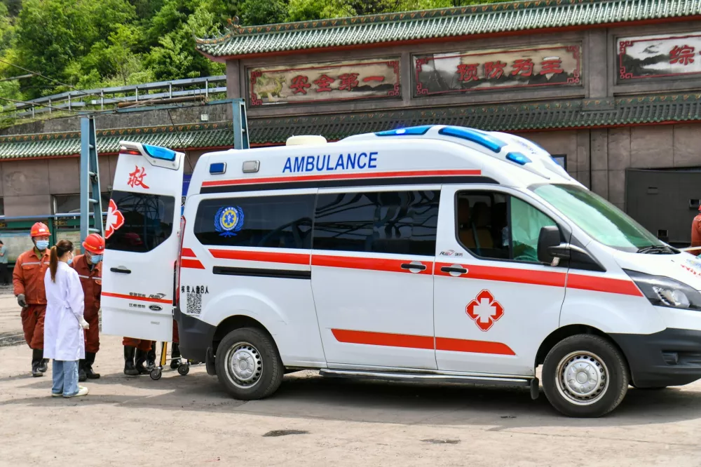 In this photo released by Xinhua News Agency, an ambulance is seen outside a coal mine in the aftermath of an explosion at Changzhi city's Liushenyu coal mine in Qinyuan county, northern China's Shanxi Province on Saturday, May 23, 2026. (Cao Yang/Xinhua via AP)