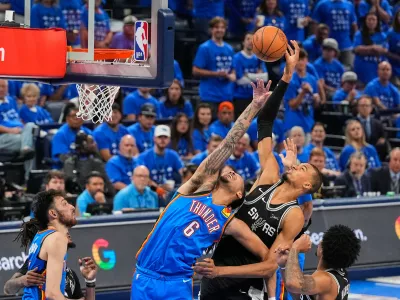 San Antonio Spurs forward Victor Wembanyama shoots against Oklahoma City Thunder forward Jaylin Williams (6) in the second half of Game 7 of the Western Conference finals of the NBA basketball playoffs series Saturday, May 30, 2026, in Oklahoma City. (AP Photo/Nate Billings)