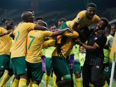 FILE - South Africa players celebrate their side's third goal during a World Cup 2026 group C qualifying soccer match between South Africa and Rwanda at Mbombela Stadium, in Nelspruit, South Africa, Oct. 14, 2025. (AP Photo/Themba Hadebe, File)